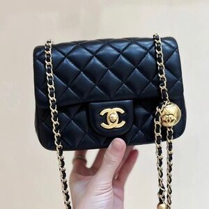 Chanel Black Quilted Mini Bag with Gold Accents